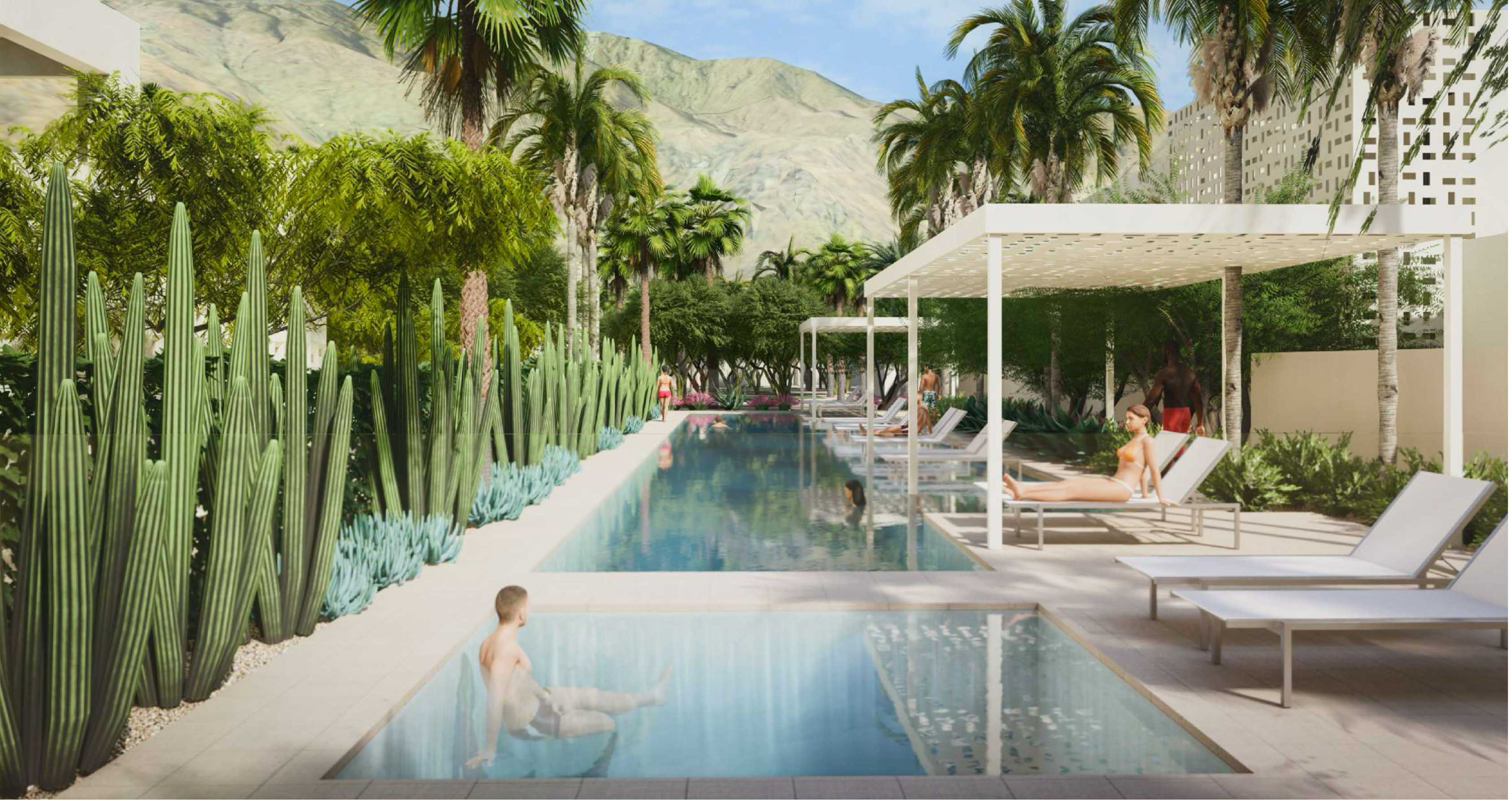 People lounging by the pool surrounded by nature with a view of the mountains