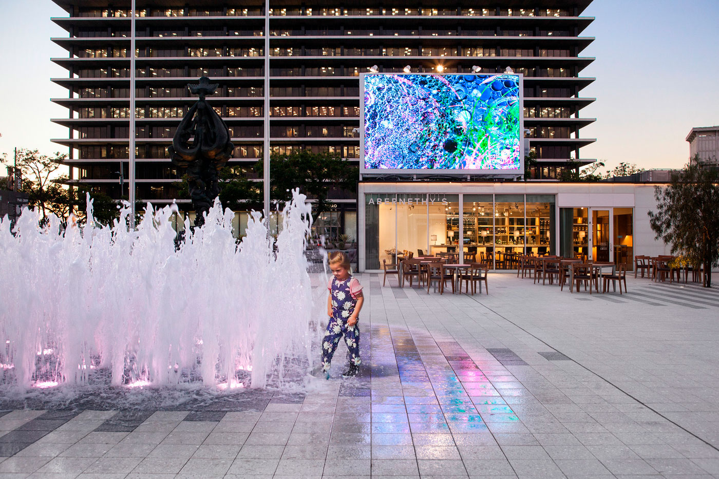 Photo of a child playing in a fountain at the Music Center Plaza